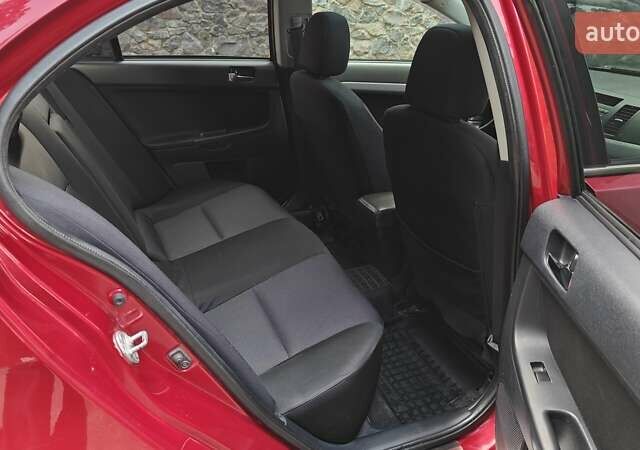 Червоний Міцубісі Lancer, об'ємом двигуна 2 л та пробігом 187 тис. км за 5500 $, фото 27 на Automoto.ua