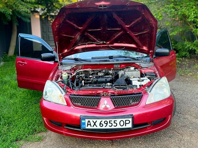 Червоний Міцубісі Lancer, об'ємом двигуна 1.6 л та пробігом 185 тис. км за 3900 $, фото 6 на Automoto.ua
