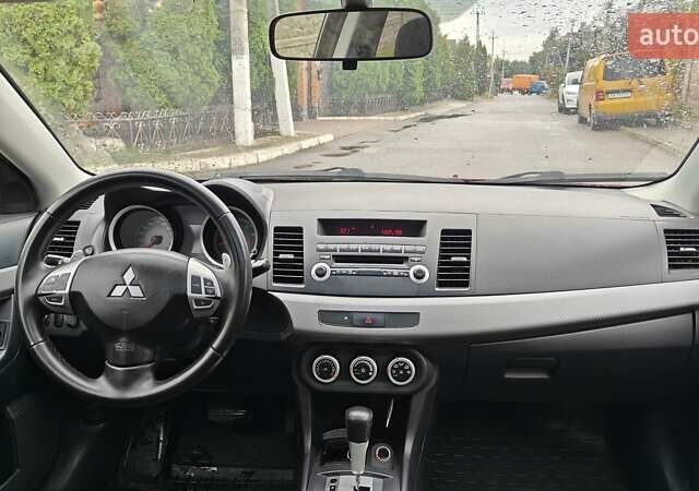 Червоний Міцубісі Lancer, об'ємом двигуна 2 л та пробігом 186 тис. км за 5600 $, фото 22 на Automoto.ua