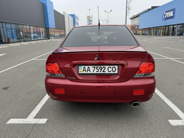 Красный Мицубиси Лансер, объемом двигателя 1.6 л и пробегом 285 тыс. км за 3650 $, фото 8 на Automoto.ua