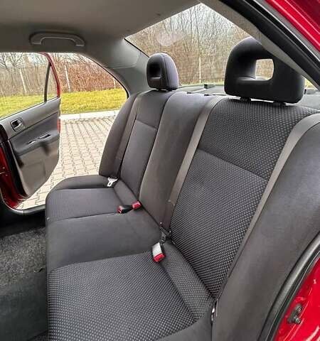 Красный Мицубиси Лансер, объемом двигателя 1.6 л и пробегом 176 тыс. км за 4300 $, фото 13 на Automoto.ua