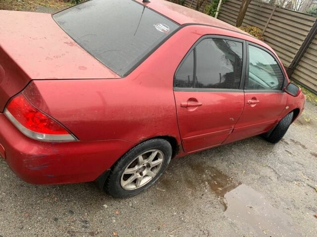 Червоний Міцубісі Lancer, об'ємом двигуна 1.6 л та пробігом 300 тис. км за 2799 $, фото 3 на Automoto.ua