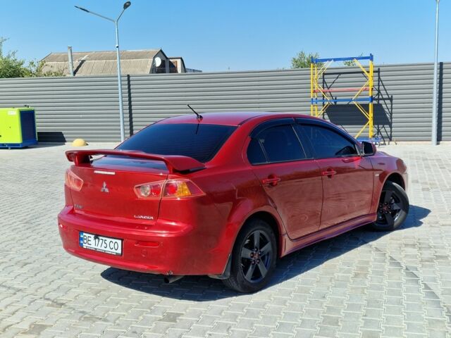 Красный Мицубиси Лансер, объемом двигателя 2 л и пробегом 274 тыс. км за 6000 $, фото 7 на Automoto.ua