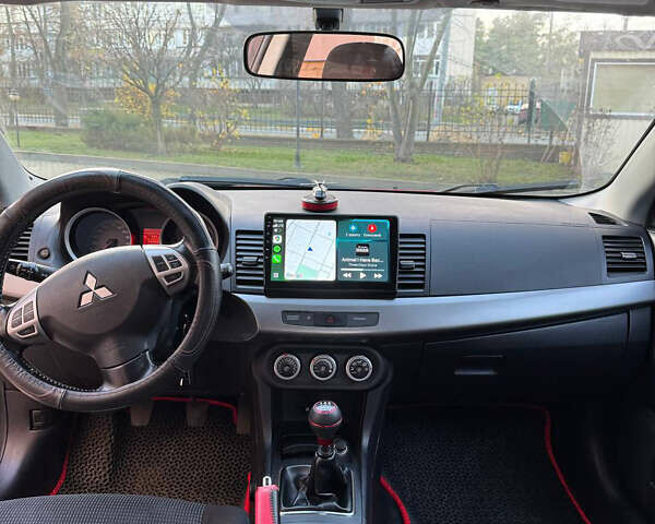 Красный Мицубиси Лансер, объемом двигателя 2 л и пробегом 143 тыс. км за 5200 $, фото 21 на Automoto.ua