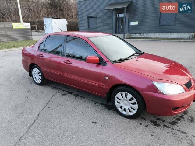 Червоний Міцубісі Lancer, об'ємом двигуна 1.58 л та пробігом 140 тис. км за 6000 $, фото 3 на Automoto.ua