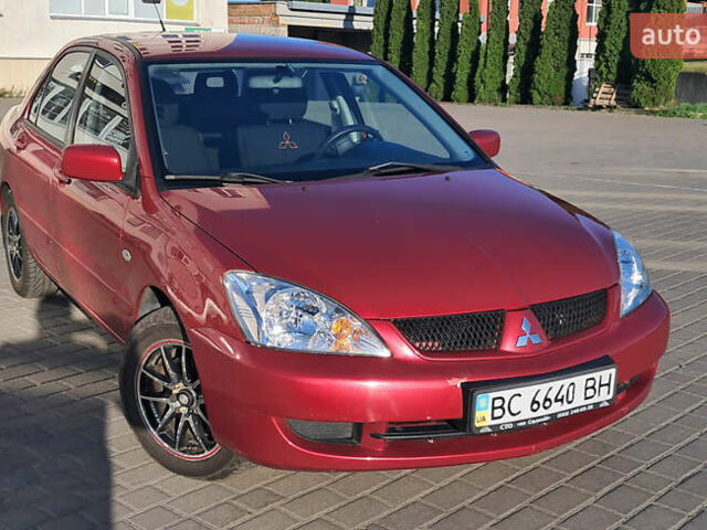 Красный Мицубиси Лансер, объемом двигателя 1.6 л и пробегом 155 тыс. км за 4150 $, фото 1 на Automoto.ua