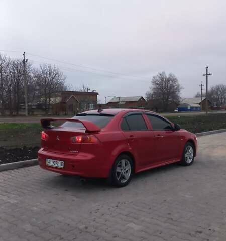 Красный Мицубиси Лансер, объемом двигателя 2 л и пробегом 200 тыс. км за 6000 $, фото 5 на Automoto.ua