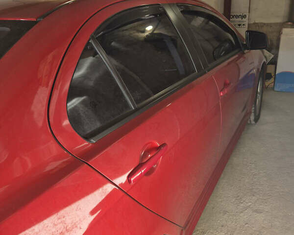 Красный Мицубиси Лансер, объемом двигателя 2 л и пробегом 65 тыс. км за 9300 $, фото 4 на Automoto.ua