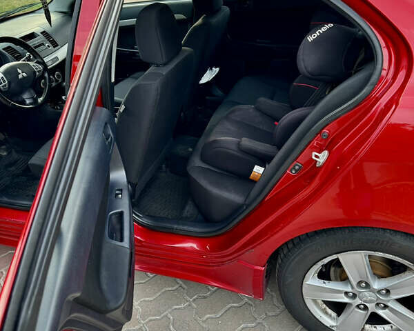 Красный Мицубиси Лансер, объемом двигателя 2 л и пробегом 365 тыс. км за 5000 $, фото 11 на Automoto.ua