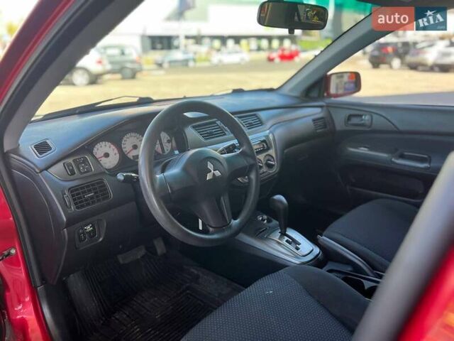 Червоний Міцубісі Lancer, об'ємом двигуна 1.58 л та пробігом 223 тис. км за 6400 $, фото 19 на Automoto.ua