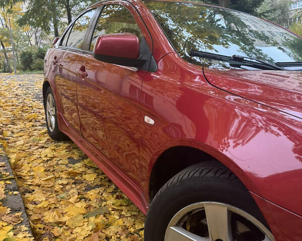 Червоний Міцубісі Lancer, об'ємом двигуна 2 л та пробігом 203 тис. км за 8000 $, фото 10 на Automoto.ua