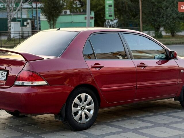 Червоний Міцубісі Lancer, об'ємом двигуна 1.6 л та пробігом 159 тис. км за 4500 $, фото 3 на Automoto.ua