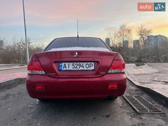Червоний Міцубісі Lancer, об'ємом двигуна 1.6 л та пробігом 141 тис. км за 4700 $, фото 7 на Automoto.ua