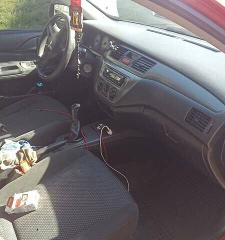 Мицубиси Лансер 2008 в Львове на Automoto.ua Красный Мицубиси Лансер, объемом двигателя 1.58 л и пробегом 280 тыс. км за 3200 $, фото 20 на Automoto.ua