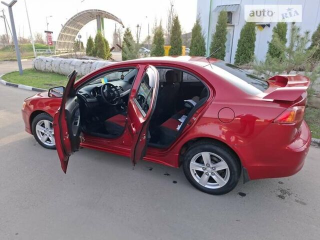 Червоний Міцубісі Lancer, об'ємом двигуна 2 л та пробігом 223 тис. км за 6950 $, фото 18 на Automoto.ua