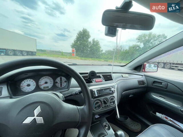 Красный Мицубиси Лансер, объемом двигателя 1.6 л и пробегом 280 тыс. км за 3500 $, фото 23 на Automoto.ua