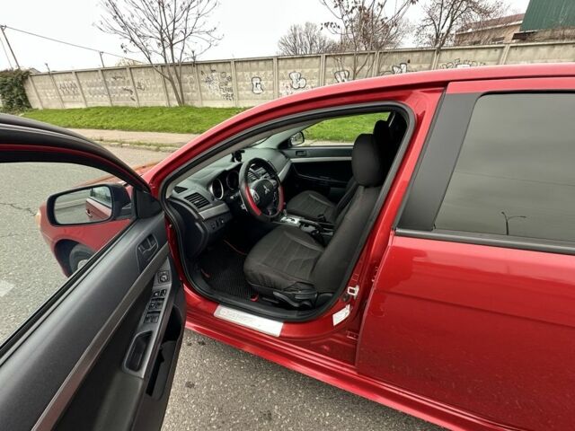 Красный Мицубиси Лансер, объемом двигателя 2 л и пробегом 366 тыс. км за 6500 $, фото 7 на Automoto.ua