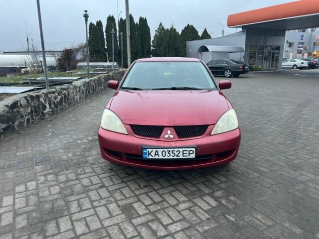 Красный Мицубиси Лансер, объемом двигателя 1.6 л и пробегом 265 тыс. км за 2956 $, фото 14 на Automoto.ua