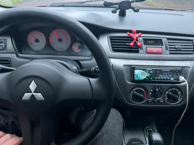 Красный Мицубиси Лансер, объемом двигателя 1.6 л и пробегом 265 тыс. км за 2956 $, фото 10 на Automoto.ua