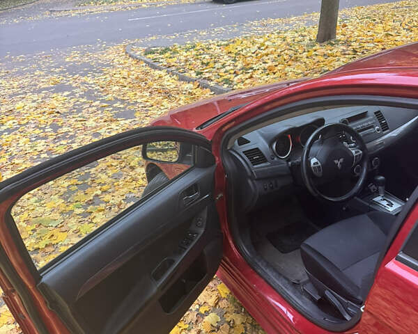 Червоний Міцубісі Lancer, об'ємом двигуна 2 л та пробігом 203 тис. км за 8000 $, фото 17 на Automoto.ua
