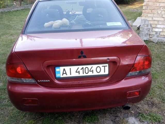 Червоний Міцубісі Lancer, об'ємом двигуна 1.6 л та пробігом 240 тис. км за 2030 $, фото 5 на Automoto.ua