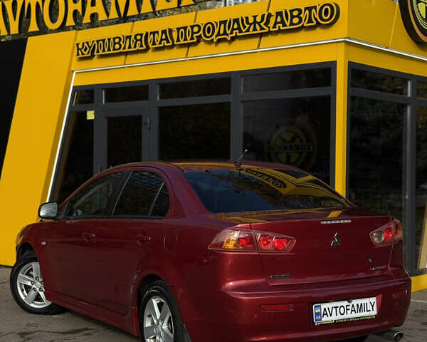Червоний Міцубісі Lancer, об'ємом двигуна 2 л та пробігом 215 тис. км за 6500 $, фото 5 на Automoto.ua