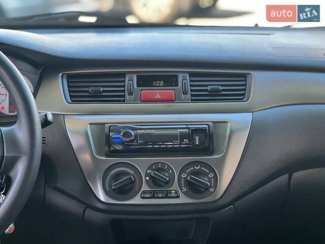 Червоний Міцубісі Lancer, об'ємом двигуна 1.58 л та пробігом 223 тис. км за 6400 $, фото 16 на Automoto.ua