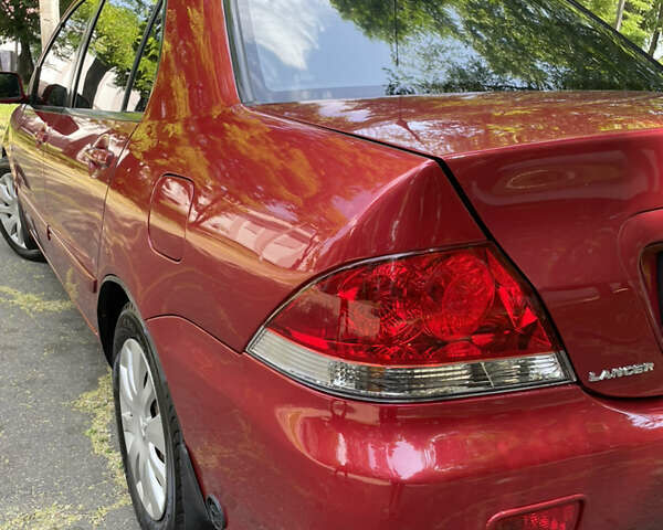 Червоний Міцубісі Lancer, об'ємом двигуна 1.6 л та пробігом 270 тис. км за 5699 $, фото 17 на Automoto.ua