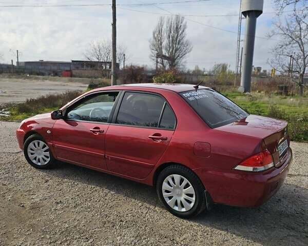 Червоний Міцубісі Lancer, об'ємом двигуна 1.6 л та пробігом 220 тис. км за 5800 $, фото 5 на Automoto.ua
