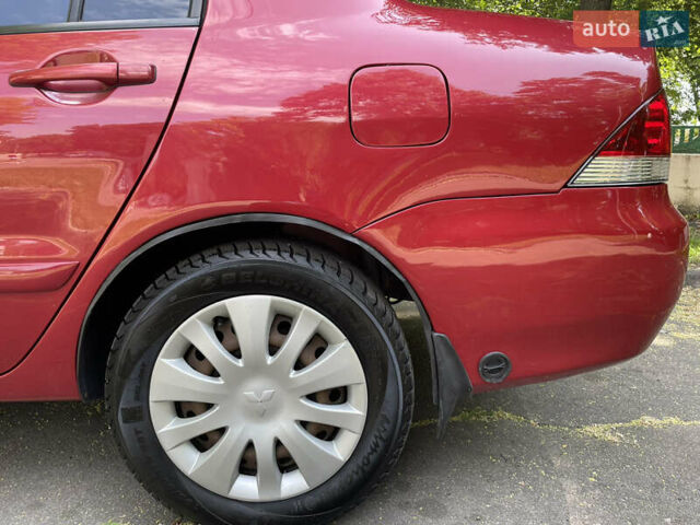 Червоний Міцубісі Lancer, об'ємом двигуна 1.6 л та пробігом 270 тис. км за 5699 $, фото 15 на Automoto.ua