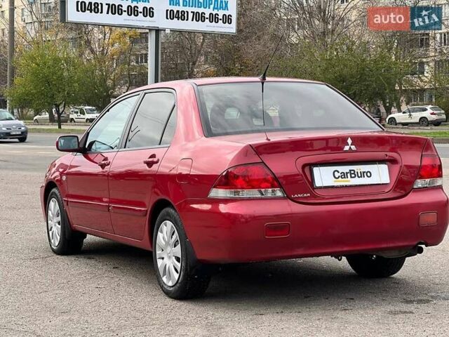 Червоний Міцубісі Lancer, об'ємом двигуна 1.58 л та пробігом 223 тис. км за 6400 $, фото 7 на Automoto.ua