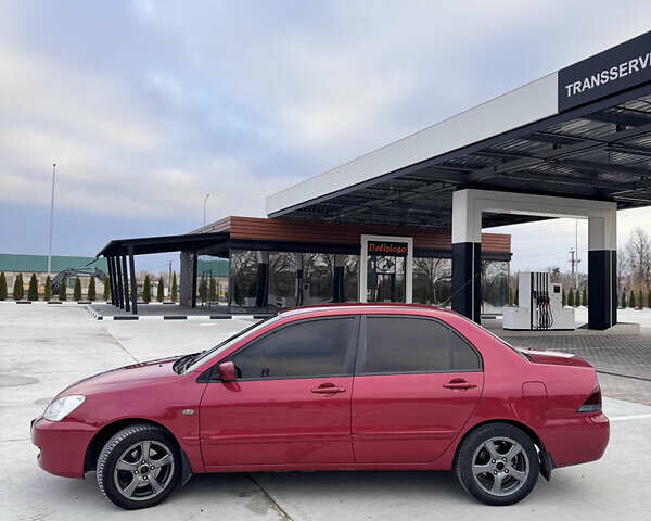 Красный Мицубиси Лансер, объемом двигателя 1.6 л и пробегом 276 тыс. км за 4550 $, фото 3 на Automoto.ua