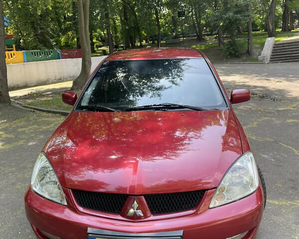Червоний Міцубісі Lancer, об'ємом двигуна 1.6 л та пробігом 270 тис. км за 5699 $, фото 3 на Automoto.ua