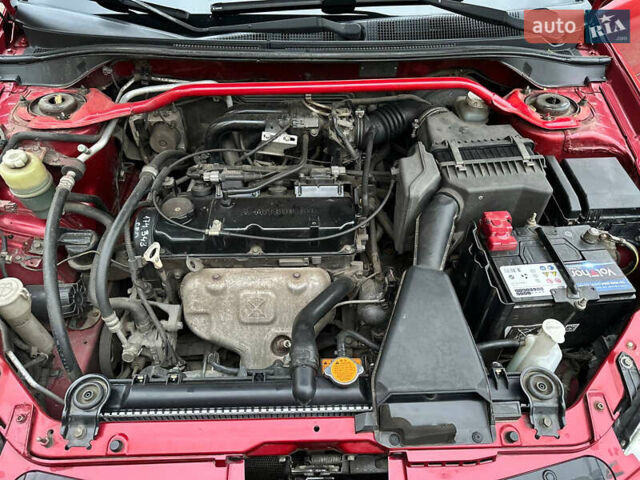 Красный Мицубиси Лансер, объемом двигателя 1.6 л и пробегом 192 тыс. км за 5999 $, фото 8 на Automoto.ua