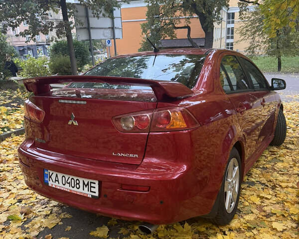 Червоний Міцубісі Lancer, об'ємом двигуна 2 л та пробігом 203 тис. км за 8000 $, фото 13 на Automoto.ua