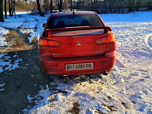 Красный Мицубиси Лансер, объемом двигателя 2 л и пробегом 200 тыс. км за 5500 $, фото 3 на Automoto.ua