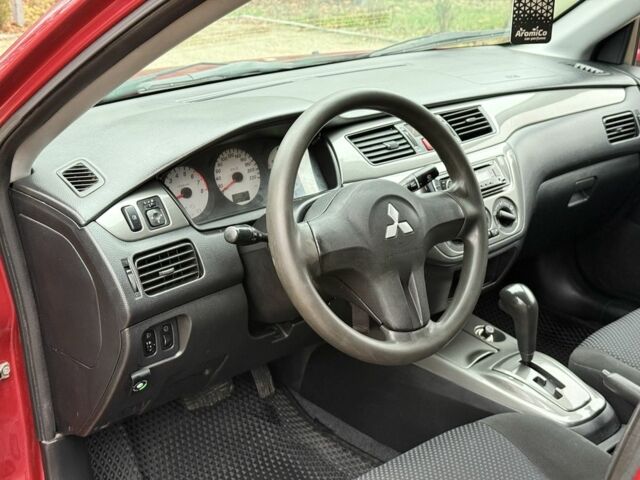 Червоний Міцубісі Lancer, об'ємом двигуна 1.6 л та пробігом 220 тис. км за 4600 $, фото 13 на Automoto.ua