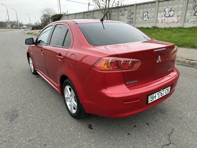 Красный Мицубиси Лансер, объемом двигателя 2 л и пробегом 366 тыс. км за 6500 $, фото 6 на Automoto.ua