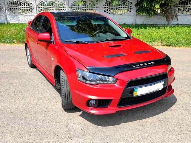 Красный Мицубиси Лансер, объемом двигателя 2 л и пробегом 300 тыс. км за 6200 $, фото 2 на Automoto.ua