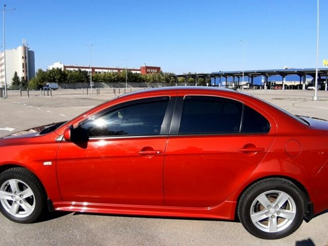 Красный Мицубиси Лансер, объемом двигателя 2 л и пробегом 110 тыс. км за 7500 $, фото 6 на Automoto.ua