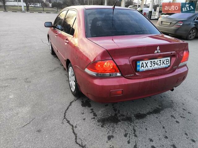 Червоний Міцубісі Lancer, об'ємом двигуна 1.58 л та пробігом 140 тис. км за 6000 $, фото 7 на Automoto.ua
