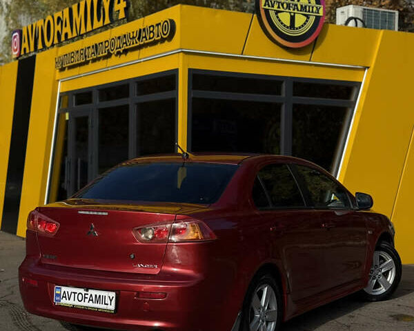 Червоний Міцубісі Lancer, об'ємом двигуна 2 л та пробігом 215 тис. км за 6500 $, фото 4 на Automoto.ua