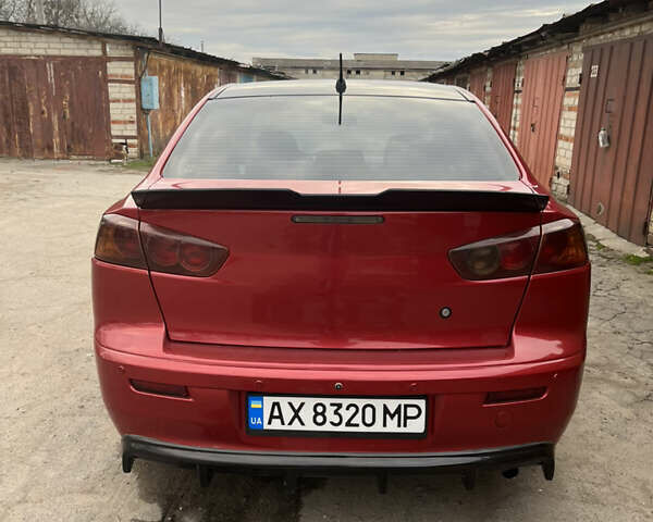 Червоний Міцубісі Lancer, об'ємом двигуна 2 л та пробігом 209 тис. км за 6900 $, фото 5 на Automoto.ua
