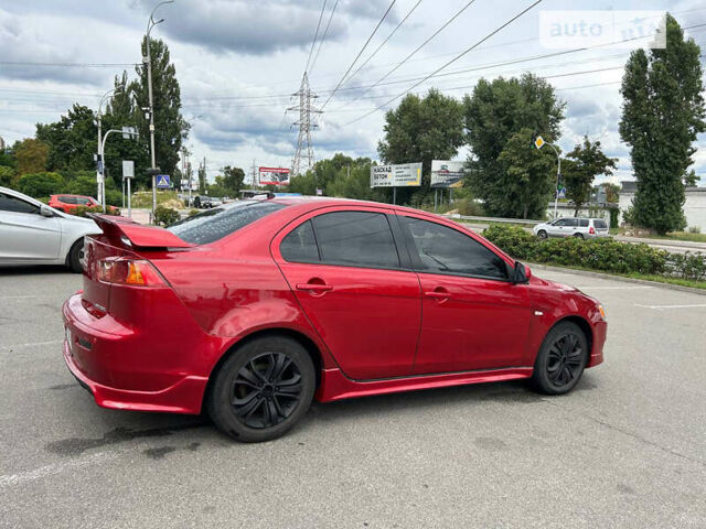 Червоний Міцубісі Lancer, об'ємом двигуна 2 л та пробігом 208 тис. км за 7500 $, фото 9 на Automoto.ua