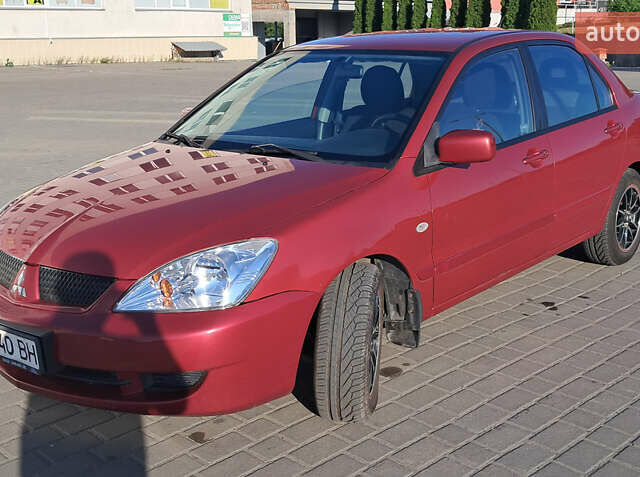 Красный Мицубиси Лансер, объемом двигателя 1.6 л и пробегом 155 тыс. км за 4150 $, фото 3 на Automoto.ua