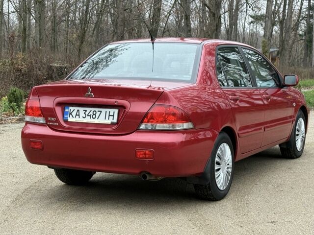 Червоний Міцубісі Lancer, об'ємом двигуна 1.6 л та пробігом 220 тис. км за 4600 $, фото 6 на Automoto.ua