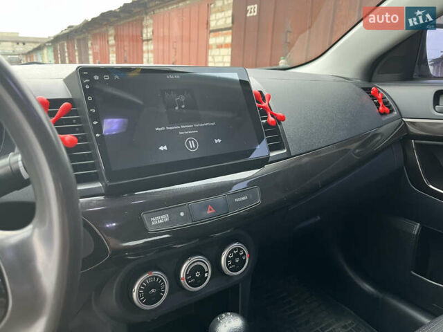 Червоний Міцубісі Lancer, об'ємом двигуна 2 л та пробігом 209 тис. км за 6900 $, фото 12 на Automoto.ua