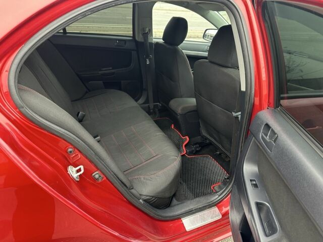 Красный Мицубиси Лансер, объемом двигателя 2 л и пробегом 366 тыс. км за 6500 $, фото 23 на Automoto.ua