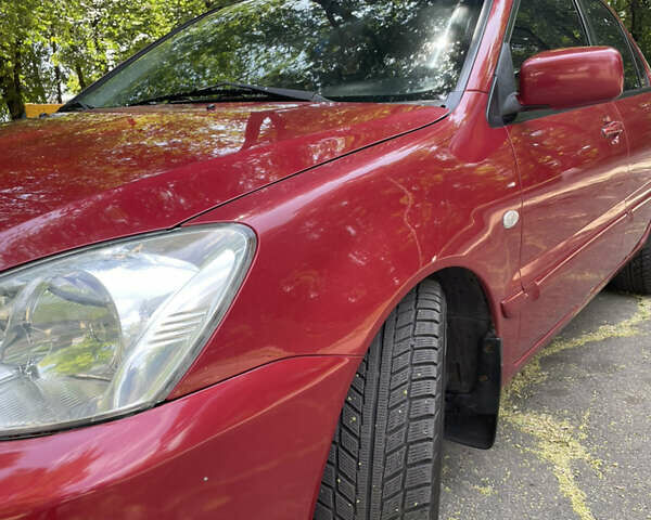 Червоний Міцубісі Lancer, об'ємом двигуна 1.6 л та пробігом 270 тис. км за 5699 $, фото 7 на Automoto.ua
