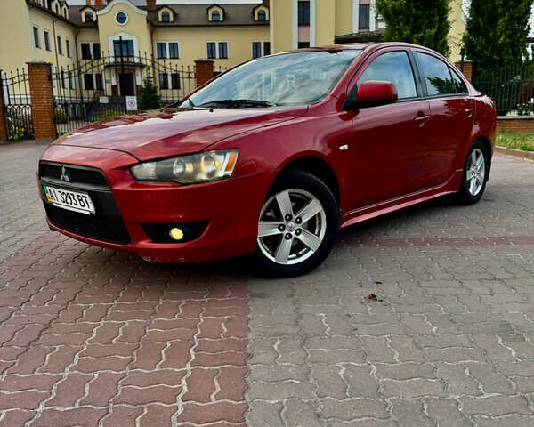 Красный Мицубиси Лансер, объемом двигателя 2 л и пробегом 365 тыс. км за 5000 $, фото 1 на Automoto.ua